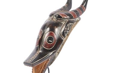 Guro carved polychrome painted wood zoomorphic Zamble mask, African Ivory Coast 16 1/2"H x 4 3/4"W