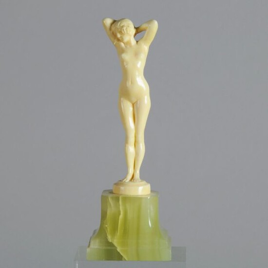 Joseph Descomps (French, 1869 ~ 1950) 'Femme Nue' - Hand carved ivory figure modelled as a naked young woman, signed Descomps. Circa 1925. Height 11 cm
