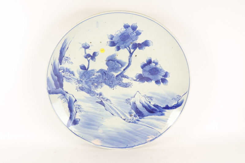 Large round Chinese porcelain dish with blue monochrome landscape decoration...