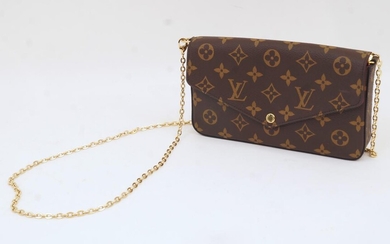 Louis Vuitton: a Pochette Felicie monogram cross body clutch, with date code SF3109 for July 2019, with press stud closure, fuschia pink interior lining with inside flat pocket, removable gilt chain, with dust bag and care card