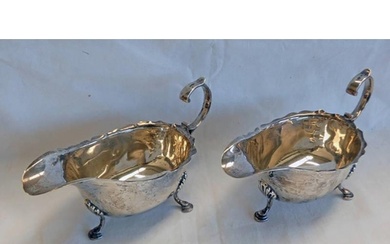 PAIR OF SILVER SAUCE BOATS WITH WAVY RIM & SCROLL HANDLE, BI...