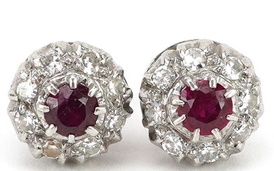 Pair of 18ct white gold ruby and diamond cluster stud earrin...
