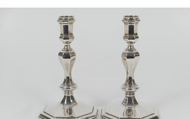 Pair of Elizabeth II cast silver candlesticks, in Queen Anne...