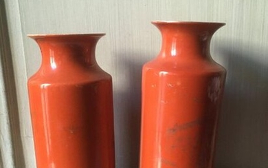 Pair of orange enamelled porcelain scroll vases, wooden base