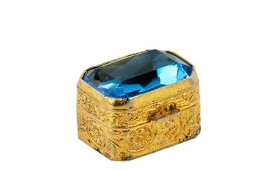 Pill box of gilded metal, with a large blue stone...