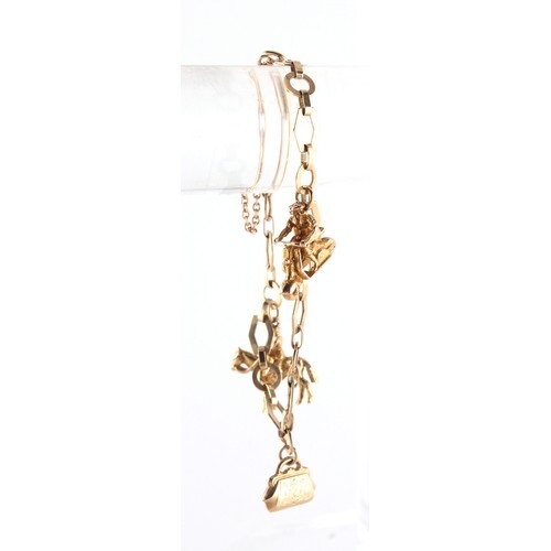 Property of a lady - a 9ct gold charm bracelet with three ch...