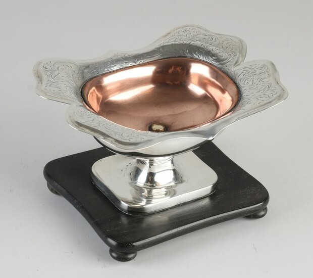 Silver pipe stove, 833/000, on wooden base with copper