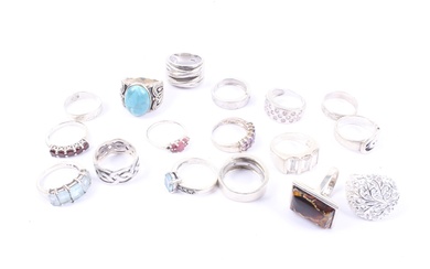 Sixteen various hallmarked silver or white metal and gem set rings.