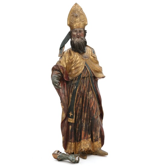 St. Nicolaus, an ecclesiastical painted and partly gilt carved wood figure, presumably Spain 18th century. H. 108 cm.