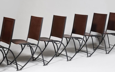 Suite of eight black lacquered wrought iron folding...