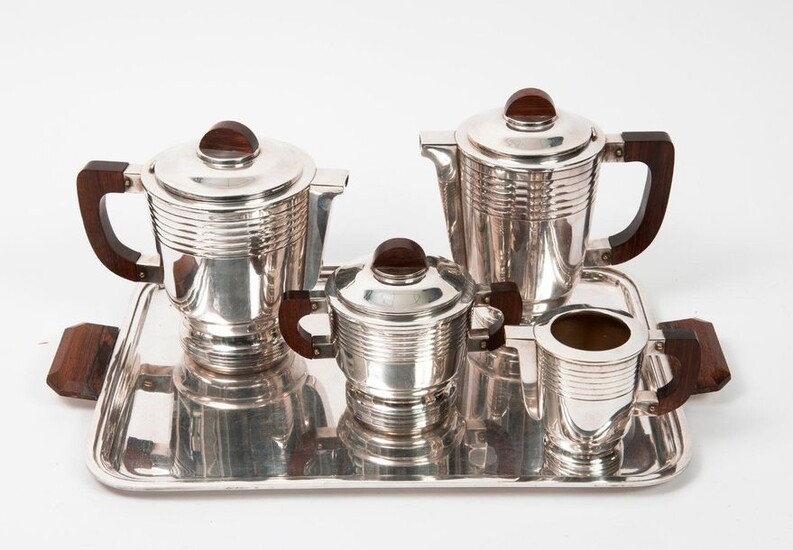Tea-coffee serving set (4 pieces) in silver plated metal decorated with fillets under the neck and on the pedestal, comprising a teapot, a coffee pot, a milk jug, a covered sugar bowl and a rectangular tray.