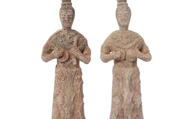 Two Chinese pottery figures of female court musicians, Tang dynasty, each modelled...