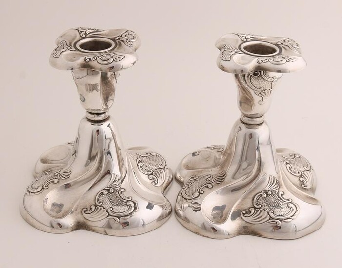 Two silver candlesticks, 830/000, outlined square model