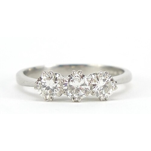 White gold diamond three stone ring, the central diamond app...