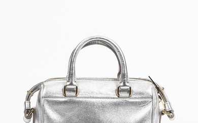 Yves Saint Laurent: A bag of silver colourd leather with gold tone hardware, shoulder strap and one zipped compartment with one interior pocket. – Bruun Rasmussen Auctioneers of Fine Art