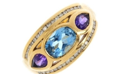 An 18ct gold diamond and gem set dress ring. The