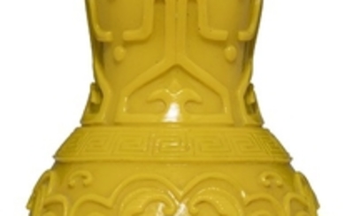 A CARVED SEMI-OPAQUE YELLOW GLASS VASE