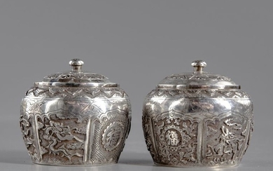 A pair of silver pots with cover