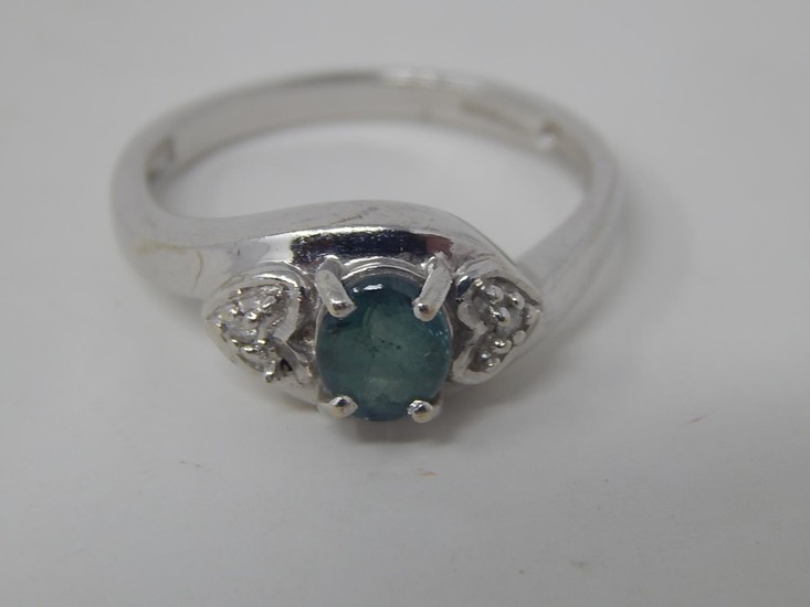 9ct white gold emerald and diamond ring, central oval cut di...