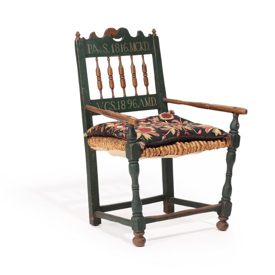A 19th century painted wood armchair carved with foliage, painted with owner's initials and year 1816, woven seat.