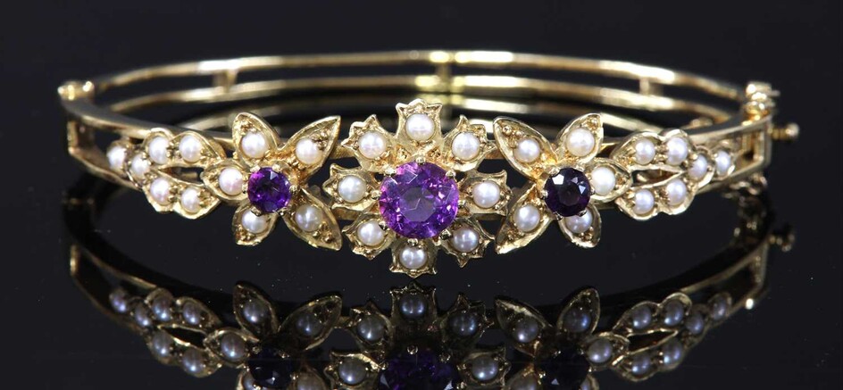A 9ct gold amethyst and split cultured pearl hinged bangle, c.1970