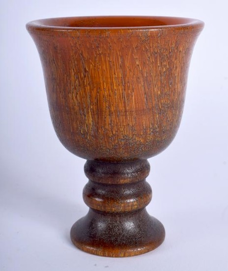 A CARVED HORN CUP formed with a flared rim. 9.5 cm