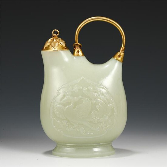 A CHINESE CARVED PHOENIX PATTERN JADE EWER WITH GILDING
