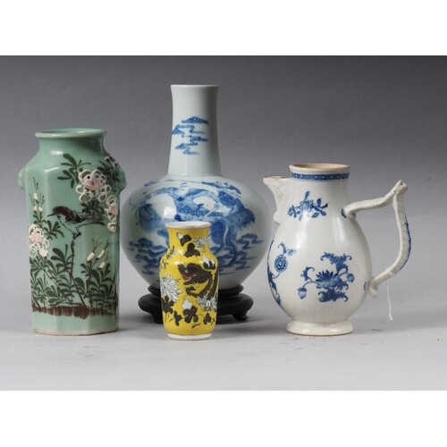 A Chinese blue and white bulbous vase, decorated figures on ...