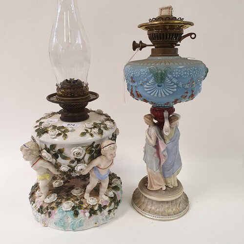 A Dresden porcelain oil lamp, flower encrusted well raised b...