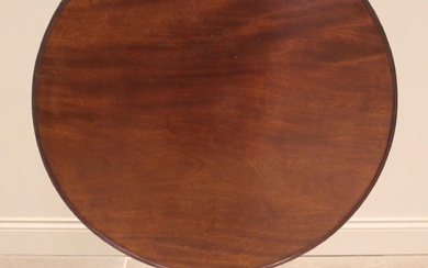 A George III mahogany tilt top tripod table, the circular to...
