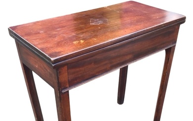 A George III mahogany turn-over-top tea table, the twin leaves...