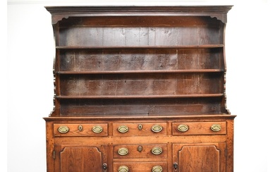 A George III oak dresser and rack, Mid Wales The boarded rac...