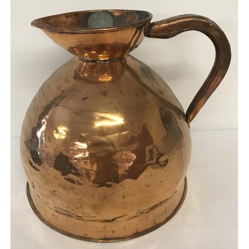 A Georgian copper 4 gallon ale jug of bulbous form, with lea...