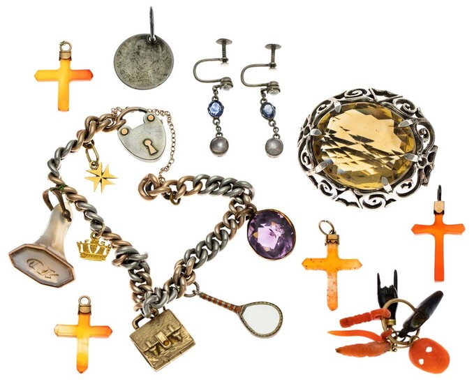 A Group of Jewelry Including a citrine brooch, a white metal link bracelet with an assortment...