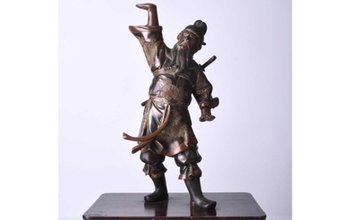 A Japanese bronze figure of a warrior, Meiji era Modelled st...