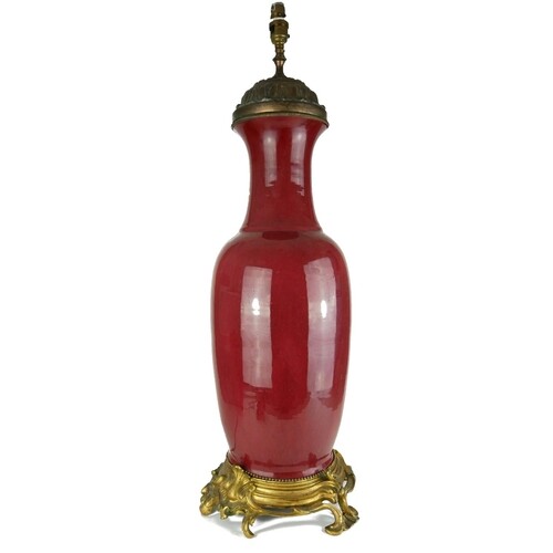 A LARGE 19TH CENTURY SANG DE BOEUF TABLE LAMP On scrolling ...