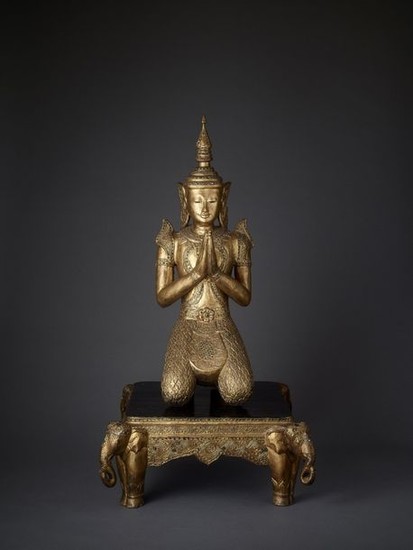 A LARGE BURMESE CARVED AND GILT LACQUERED WOOD...