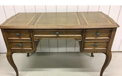 A Louis XV style, walnut desk. Features a false fronted fili...