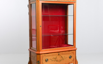 A Louis XVI style display cabinet, second part of the 20th century.