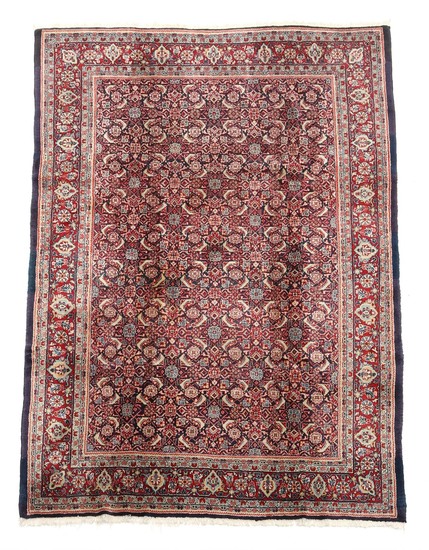 A Persian Sarough Mahal carpet, classic design on blue base. 20th century. 272×190 cm.
