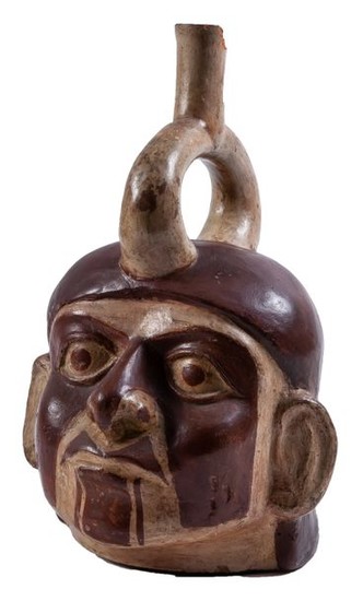 A Pre-Columbian head-shaped pottery vase