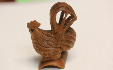 A Signed Japanese Carved Wood Chicken Netsuke
