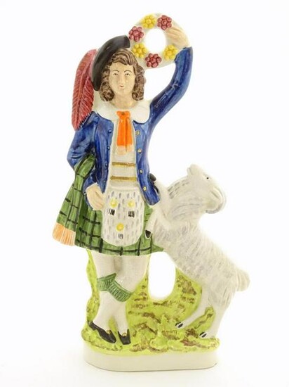 A Staffordshire pottery figure of a Highland man