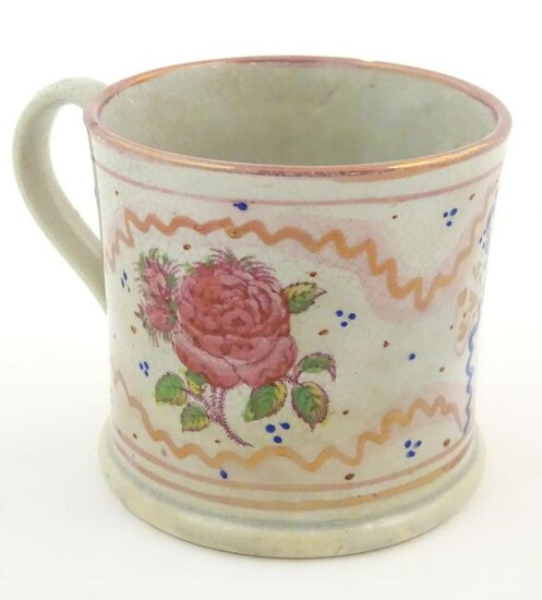 A Sunderland lustre mug with hand painted rose flower