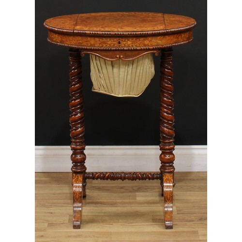 A Victorian walnut and marquetry work table, oval top with b...