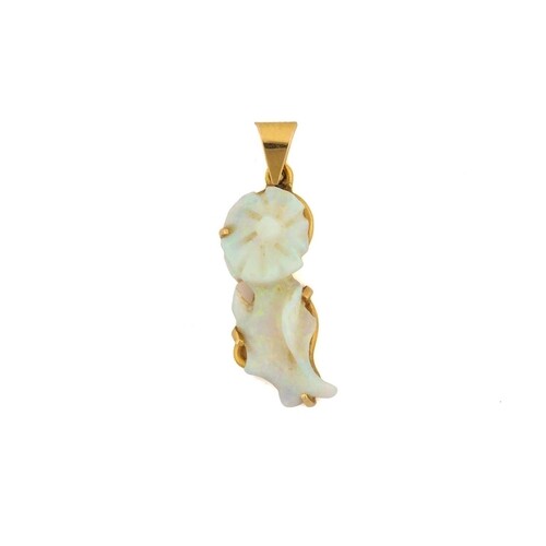 A carved opal pendant, comprises precious opal with a light ...