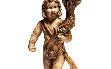 A carved southern German Angel with candelabra, circa