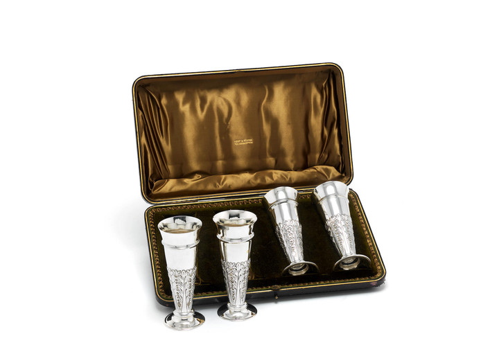 A cased set of four Edwardian silver vases