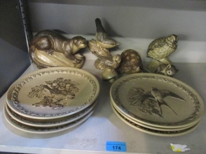 A collection of Poole stoneware pottery to include collector...