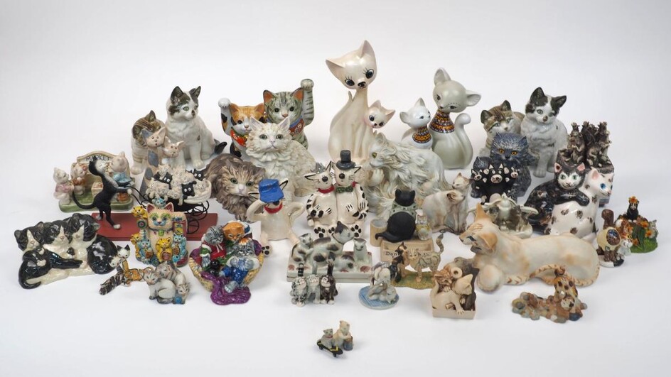 A collection of cat figural groups, to include a pair of Kunstabteilung figural groups, a Kaiser group, a Gulleyware group, and others, tallest 24cm high (lot)